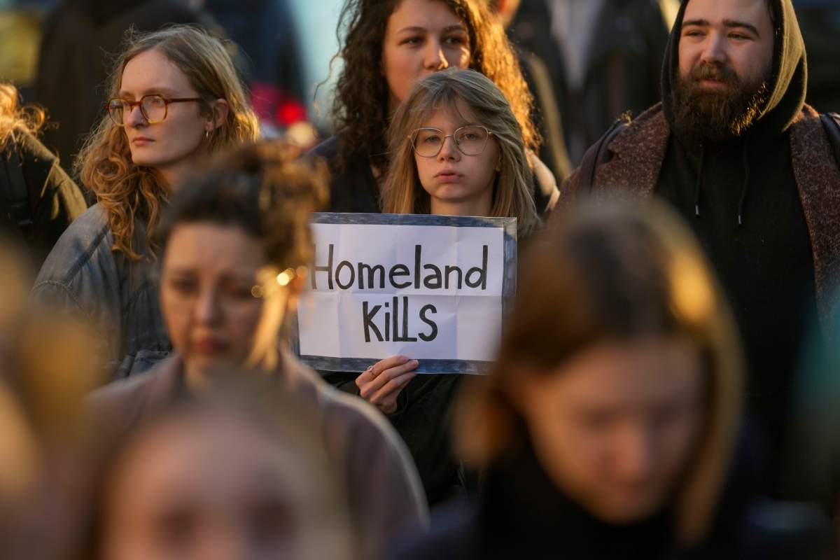 People attend a protest in front of Russian embassy in Belgrade, Serbia, Friday, Feb. 16, 2024. Navalny, who crusaded against official corruption and staged massive anti-Kremlin protests as President Vladimir Putin’s fiercest foe, died Friday in the Arctic penal colony where he was serving a 19-year sentence, Russia’s prison agency said. He was 47. (AP Photo/Darko Vojinovic)