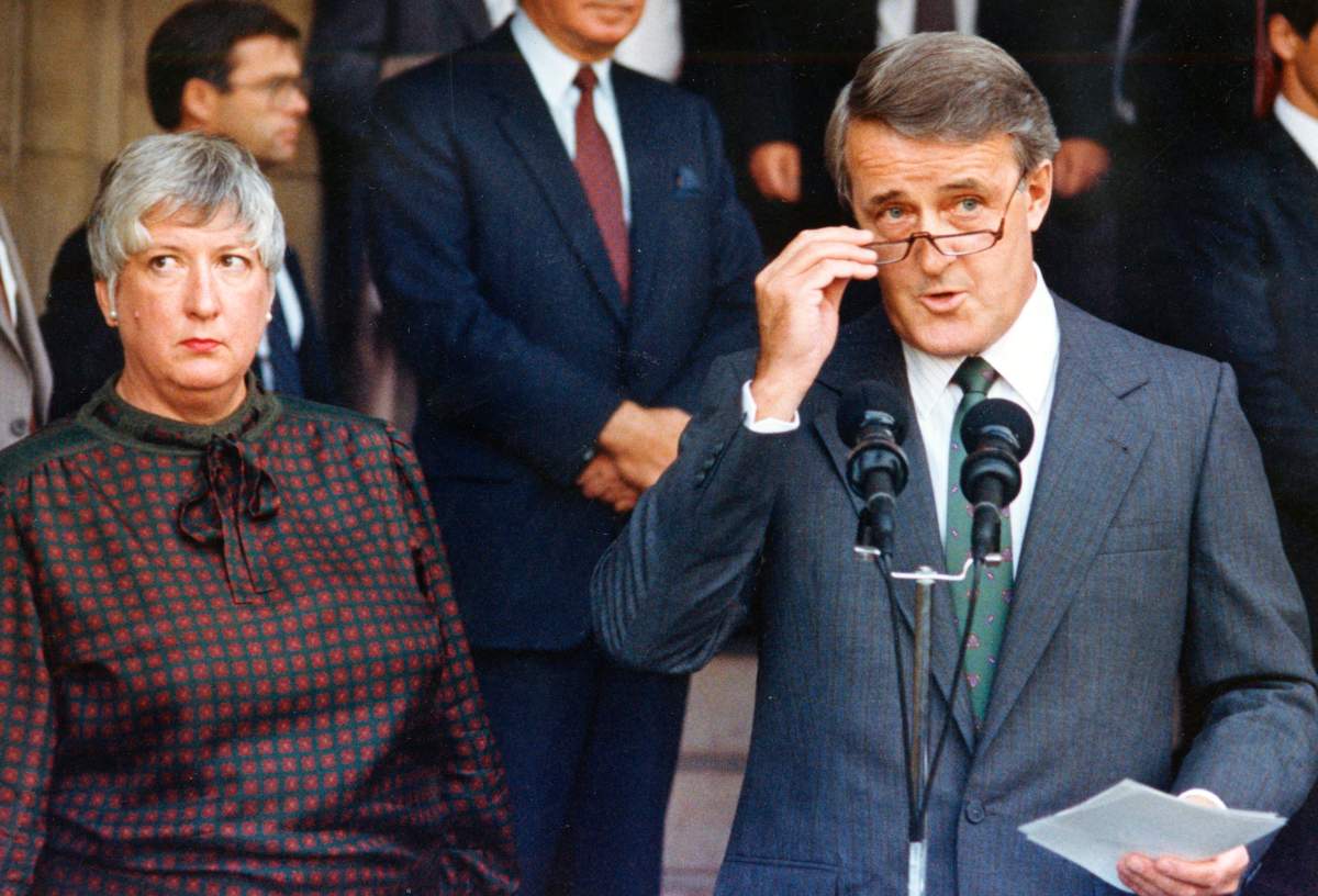 Then prime minister Brian Mulroney, along with the trade minister Pat Carney, makes a statement after briefing the provincial premiers on the state of the North American trade talks in this Sept. 14, 1987, file photo in Ottawa.