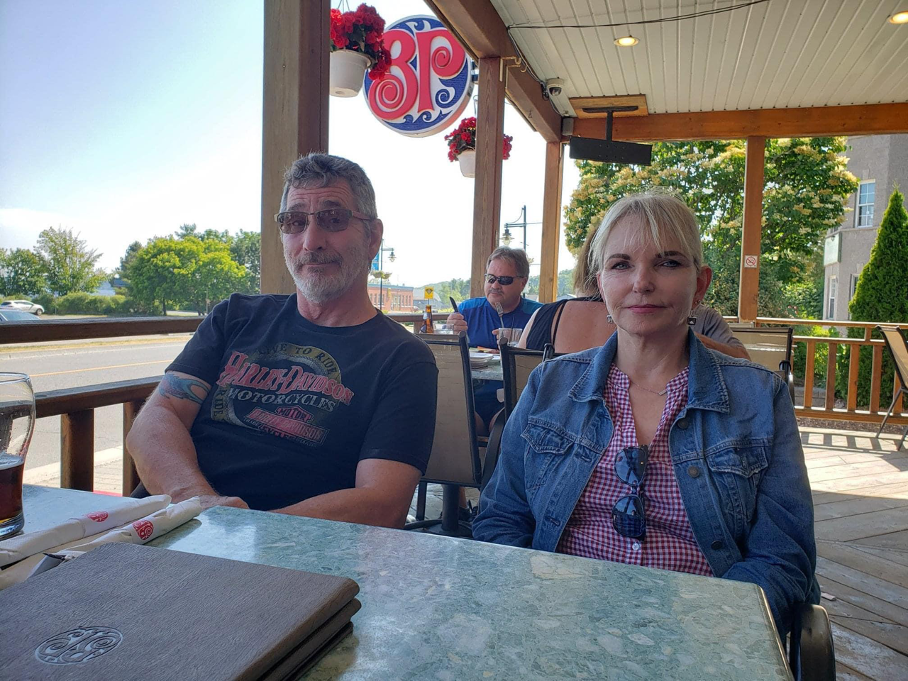 Mike, 66, and Elaine Foley, 67 sitting at a resturant.
