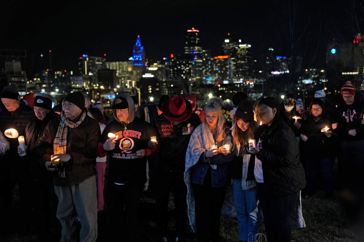 People attend a candlelight vigil for victims of a shooting at a Kansas City Chiefs Super Bowl victory rally Thursday, Feb. 15, 2024 in Kansas City, Mo. More than 20 people were injured and one woman killed in the shooting near the end of Wednesday’s rally held at nearby Union Station.