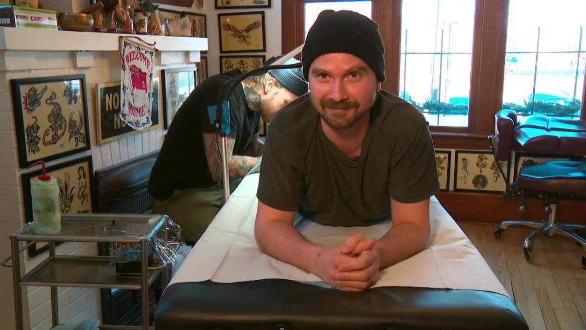 Ryan Brodziak gets a sausage tattoo on the back of his leg to get free sausage from Stawnichy's Mundare Sausage Tuesday, Feb. 13, 2024.