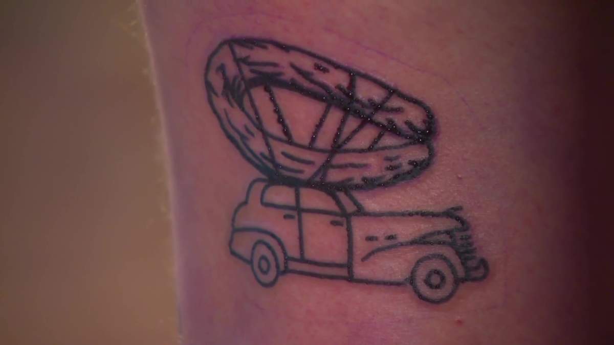 Ryan Brodziak gets a sausage tattoo on the back of his leg to get free sausage from Stawnichy's Mundare Sausage Tuesday, Feb. 13, 2024.