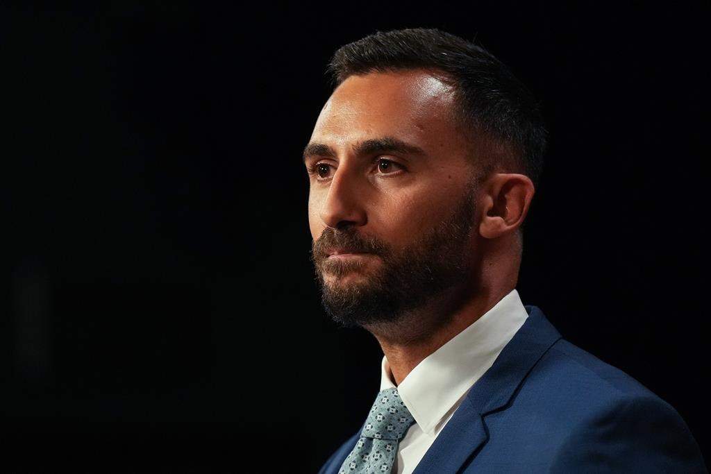 Ontario Education Minister Stephen Lecce speaks to journalists at the Queen's Park Legislature in Toronto, on Friday August 25, 2023.