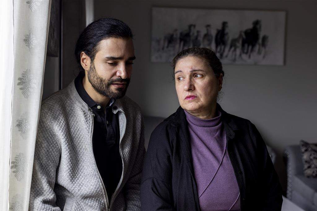 Palestinian Canadians, Marcus Karashuli, 36, and his mother, Sawsan Karashuli, 62, have applied through the federal government visa program to get two family members out of Gaza. They say one of those family members has now starved to death while waiting to hear something from the government in Kitchener, Ont., on Friday, March 15, 2024. THE CANADIAN PRESS/Carlos Osorio.