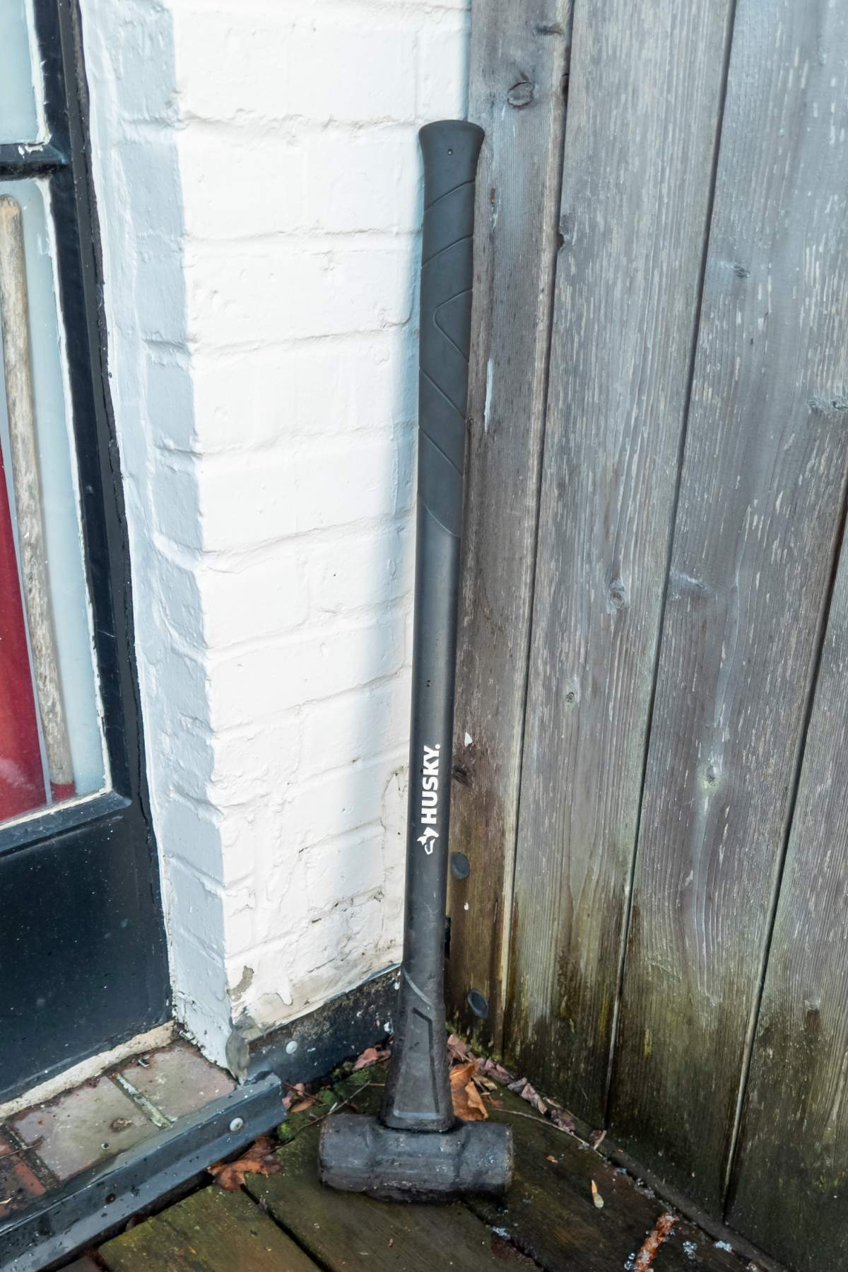 The sledgehammer the roofers left behind sits propped up in a corner on Stuart's roof.