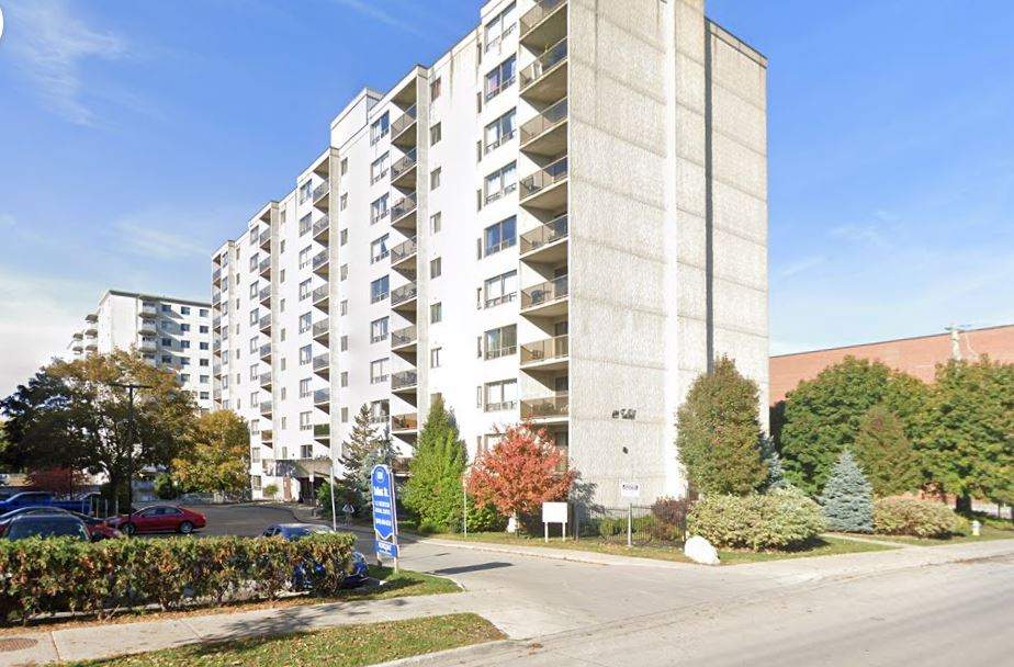 A photo of a multi-level apartment building on a sunny day.