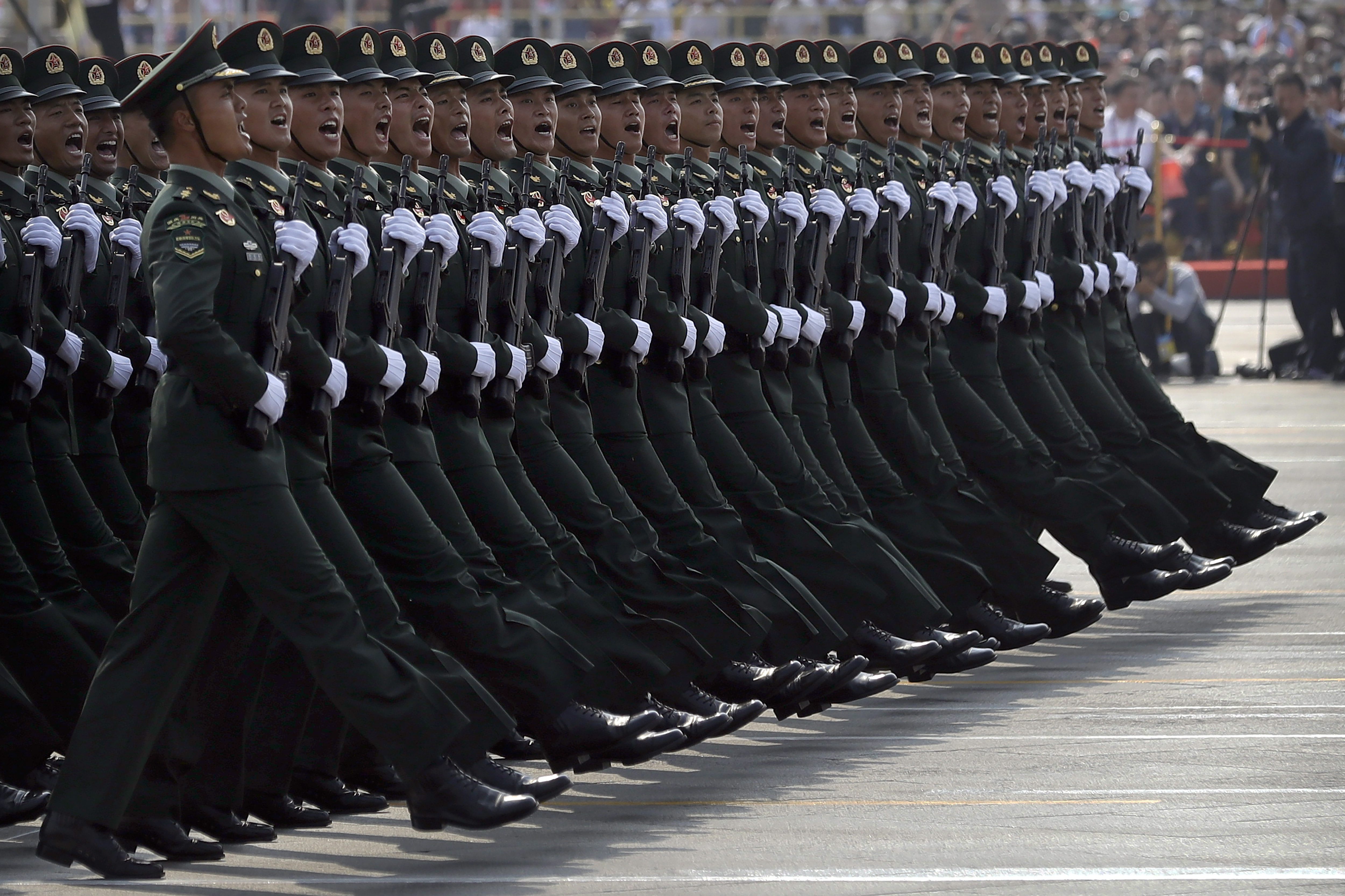 People’s Liberation Army troops commemorate 70th anniversary of the founding of Communist China, Oct. 1, 2019. (AP Photo/Mark Schiefelbein)