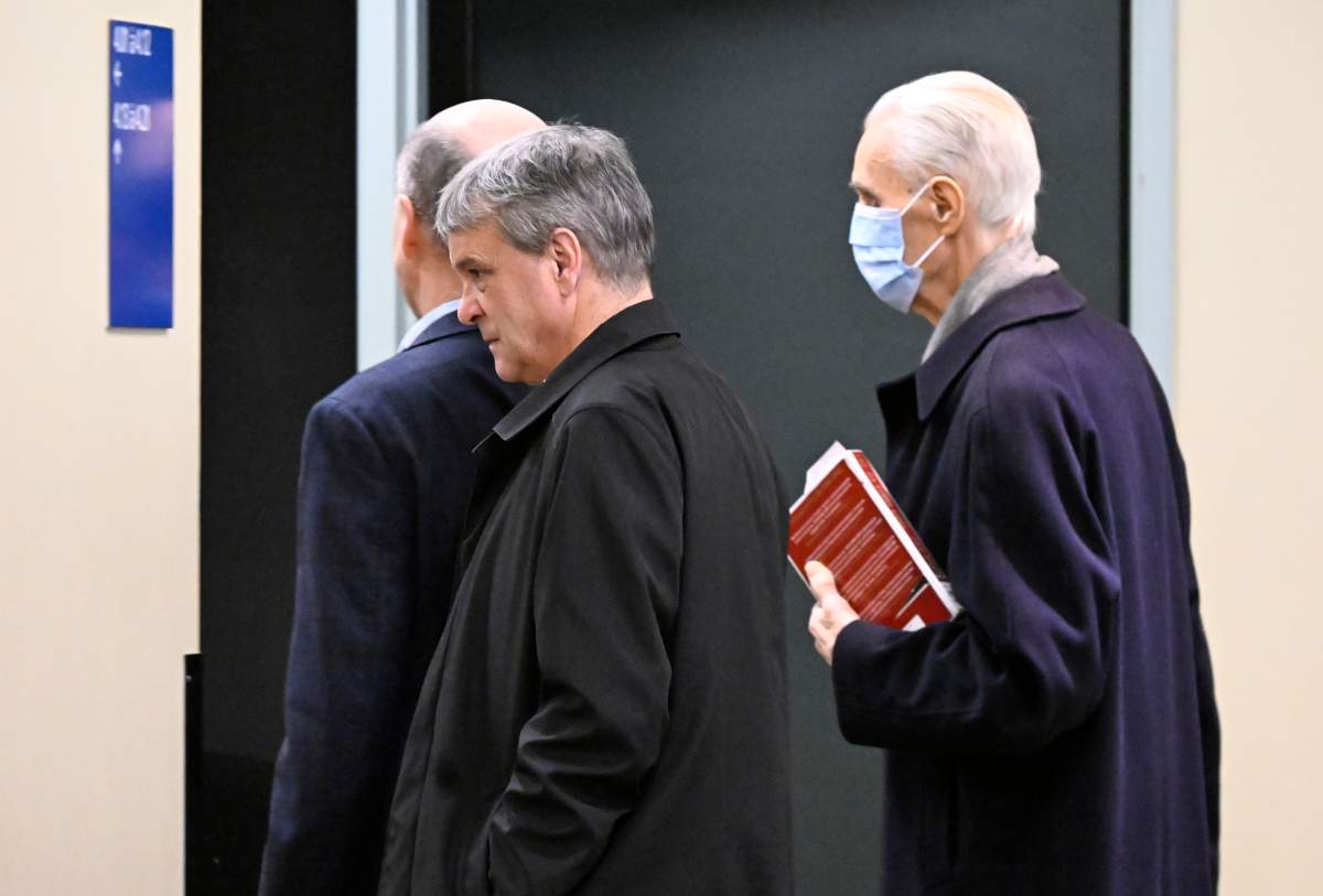 Former Quebec Court of Appeal judge Jacques Delisle (right) and his son Jean Delisle walk to the courtroom at the Hall of Justice in Quebec City, Thursday, March 14, 2024.
