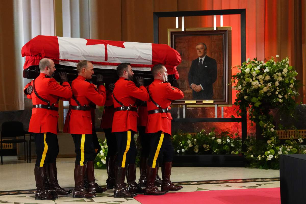 A honour guard carries the casket of former prime minister Brian Mulroney.