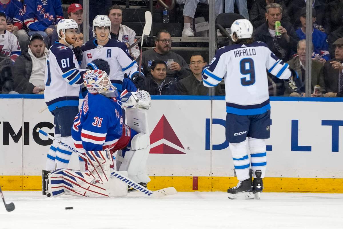 New York Rangers goaltender Igor Shesterkin (31) reacts as Winnipeg Jets center Mark Scheifele (55) celebrates after scoring with left wing Kyle Connor (81) and left wing Alex Iafallo (9) during the second period of an NHL hockey game, Tuesday, March 19, 2024, at Madison Square Garden in New York. (AP Photo/Mary Altaffer)