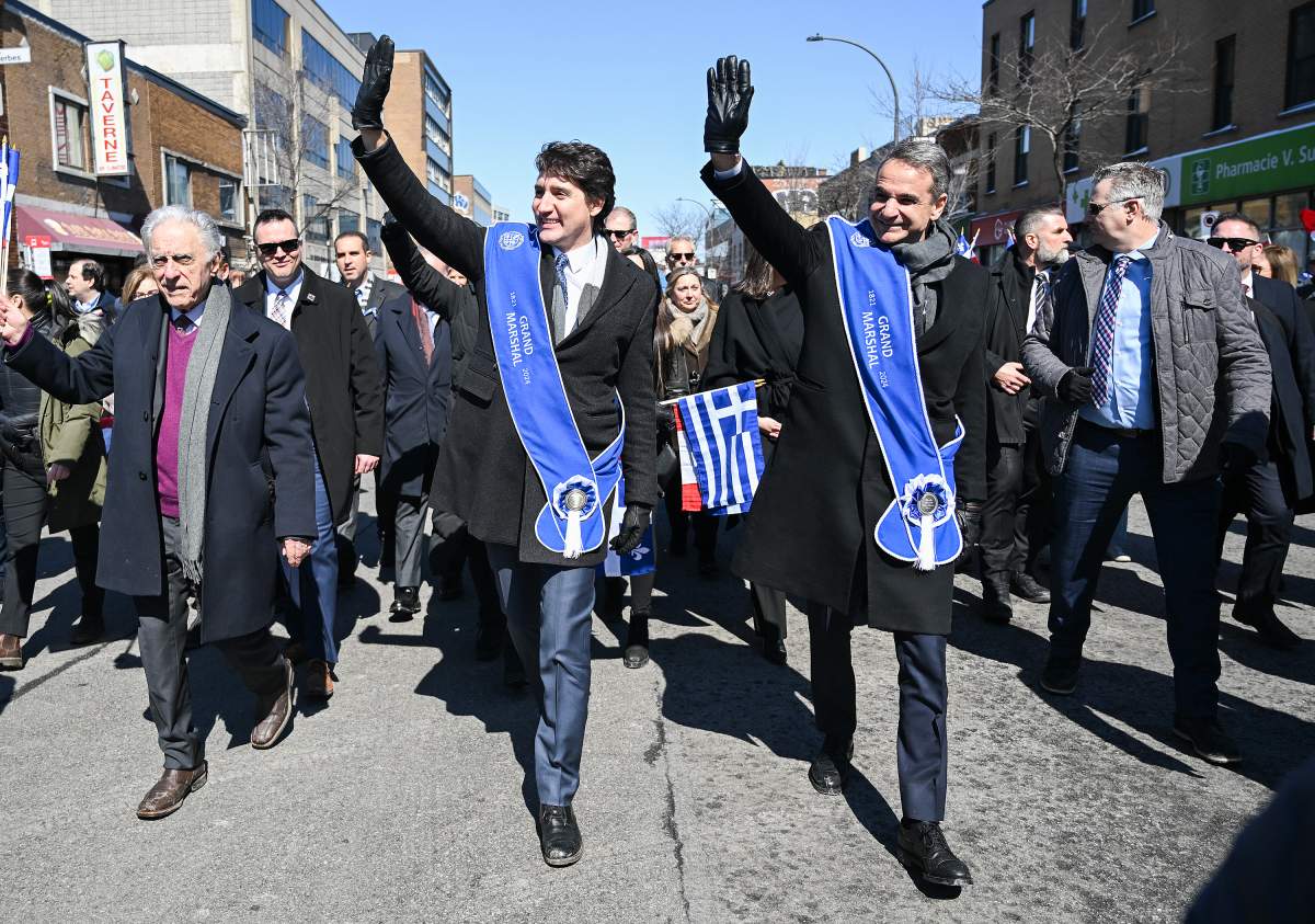 Prime Minister Justin Trudeau, left, and Prime Minister of Greece Kyriakos Mitsotakis attend the Greek Independence Day parade in Montreal, Sunday, March 24, 2024. THE CANADIAN PRESS/Graham Hughes