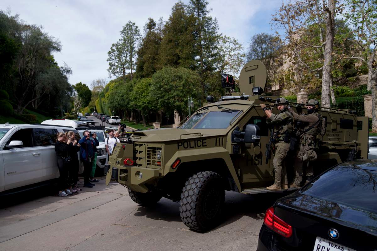 Law enforcement rides an armoured vehicle near a property belonging to Sean "Diddy" Combs on Monday, March 25, 2024, in Los Angeles.
