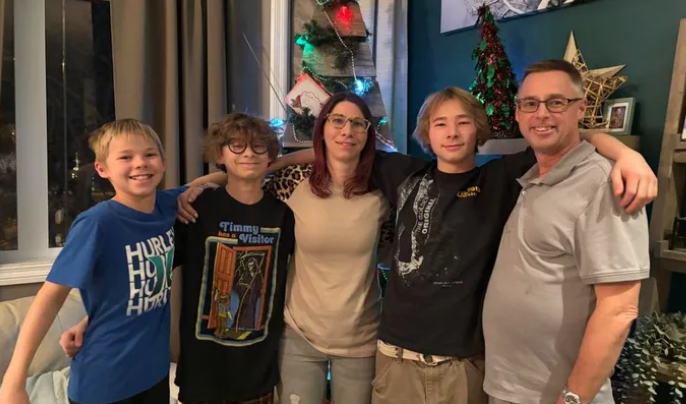 An undated photo of Matt and Angela Manhard and their three sons.