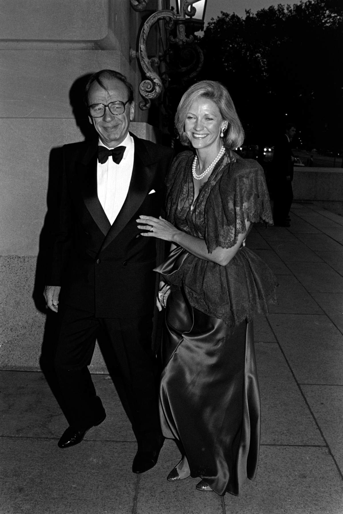 A black-and-white photo of Rupert Murdoch and Anna Mann in formalwear.