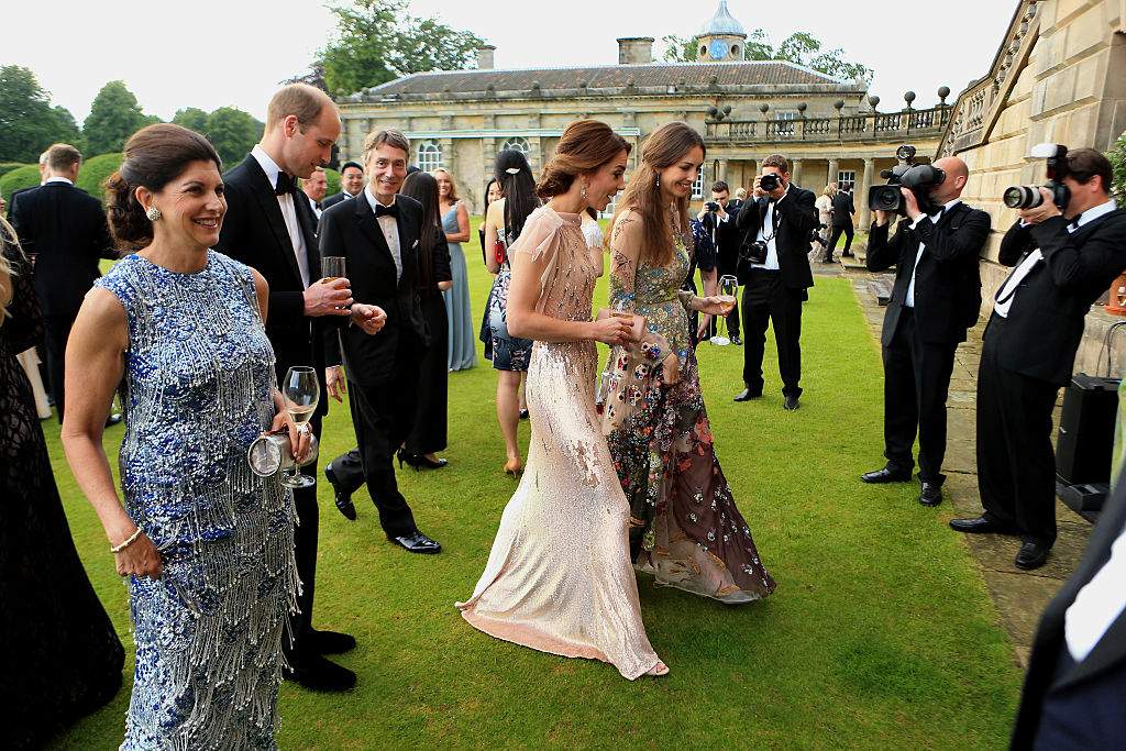 Prince William and Catherine, Duchess of Cambridge attend a gala dinner in support of East Anglia's Children's Hospices' nook appeal at Houghton Hall on June 22, 2016 in King's Lynn, England. They are pictured walking with Rose Hanbury.