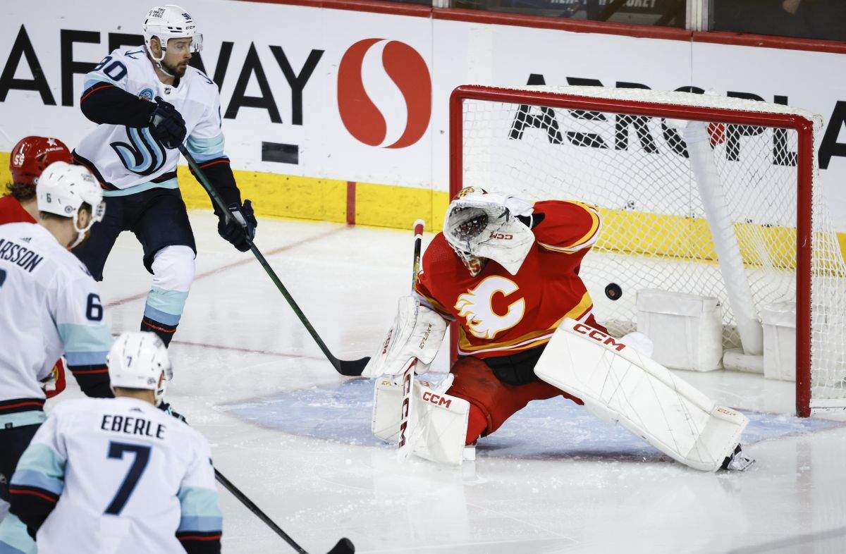 Seattle Kraken defenceman Adam Larsson (6) scores on Calgary Flames goalie Jacob Markstrom (25) as forward Tomas Tatar (90) and forward Jordan Eberle (7) look on during third period NHL hockey action in Calgary, Monday, March 4, 2024.