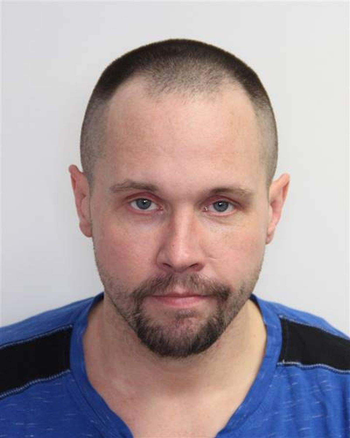 Edmonton police said Travis Damian Houle, 35, is facing charges of aggravated assault, robbery and failure to comply with a probation order in connection with an assault on Edmonton's Churchill LRT platform on Feb. 24, 2024.