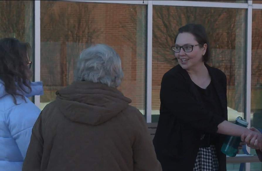 Medicine Hat Mayor Linnsie Clark shakes hands with supporters following an announcement saying she will be pursuing legal action following council voting to strip her of her powers of mayor.