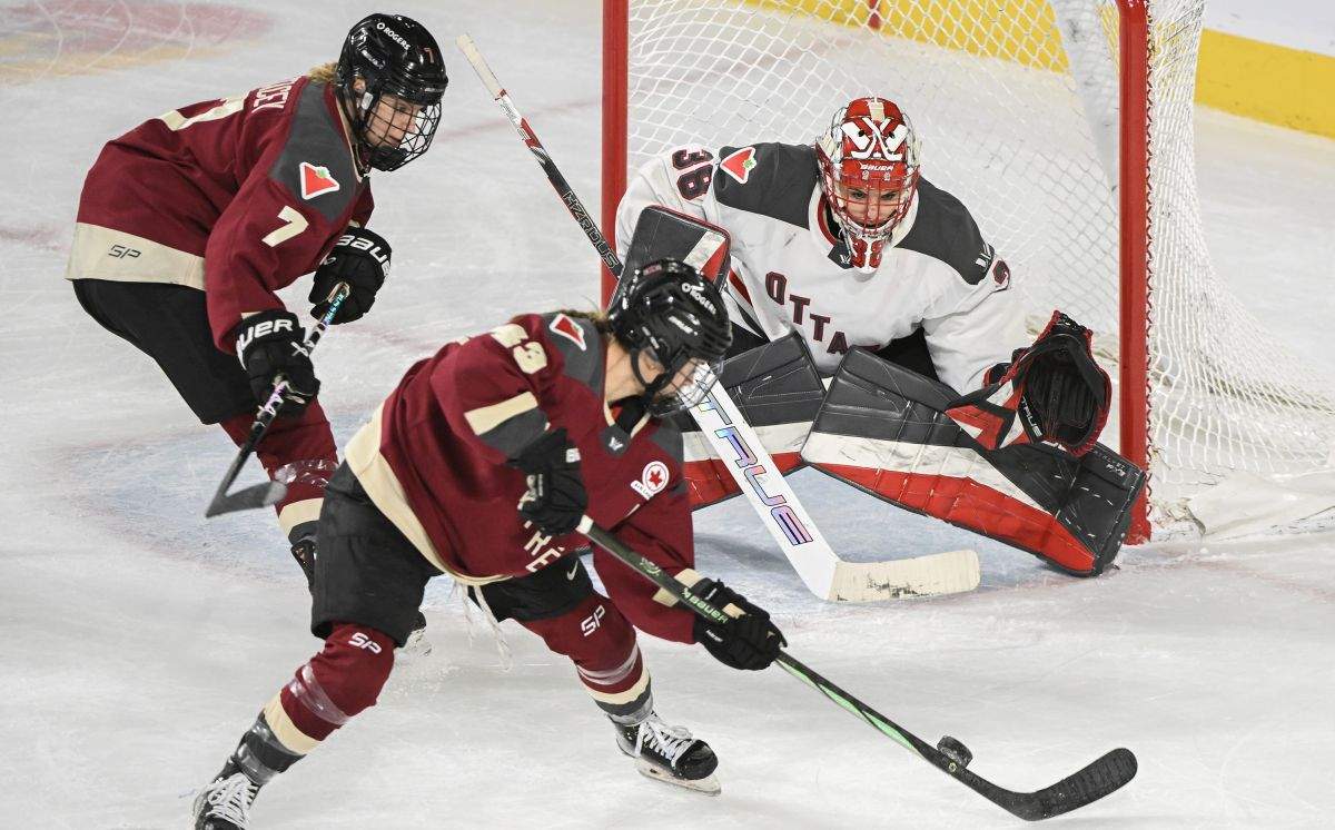 Montreal's Laura Stacey (7) and Kristin O'Neill (43) move in on Ottawa goaltender Emerance Maschmeyer during second period PWHL hockey action in Laval, Que., Sunday, March 10, 2024.