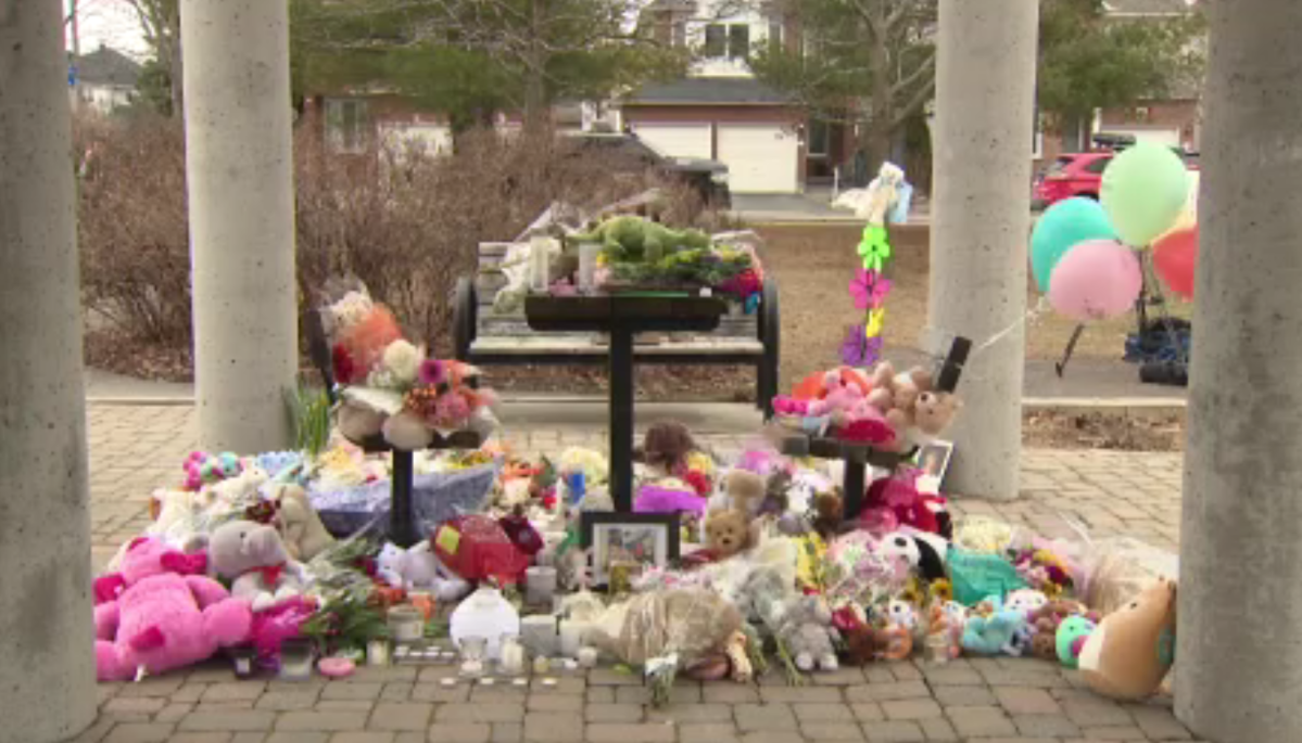 Ottawa community members bring flowers, teddy bears, notes and balloons to a vigil Saturday to mourn the six victims of a mass killing this week.