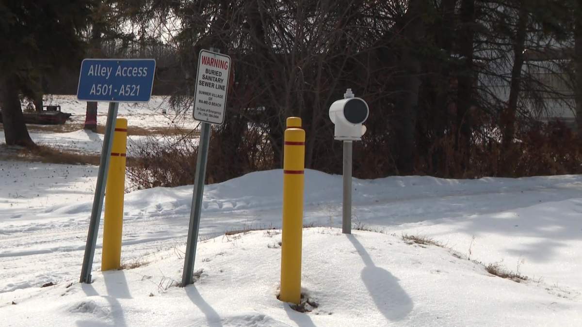 A buried sewer line sign in at the village of Ma-Me-O Beach in central Alberta on Tuesday, March 26, 2024.
