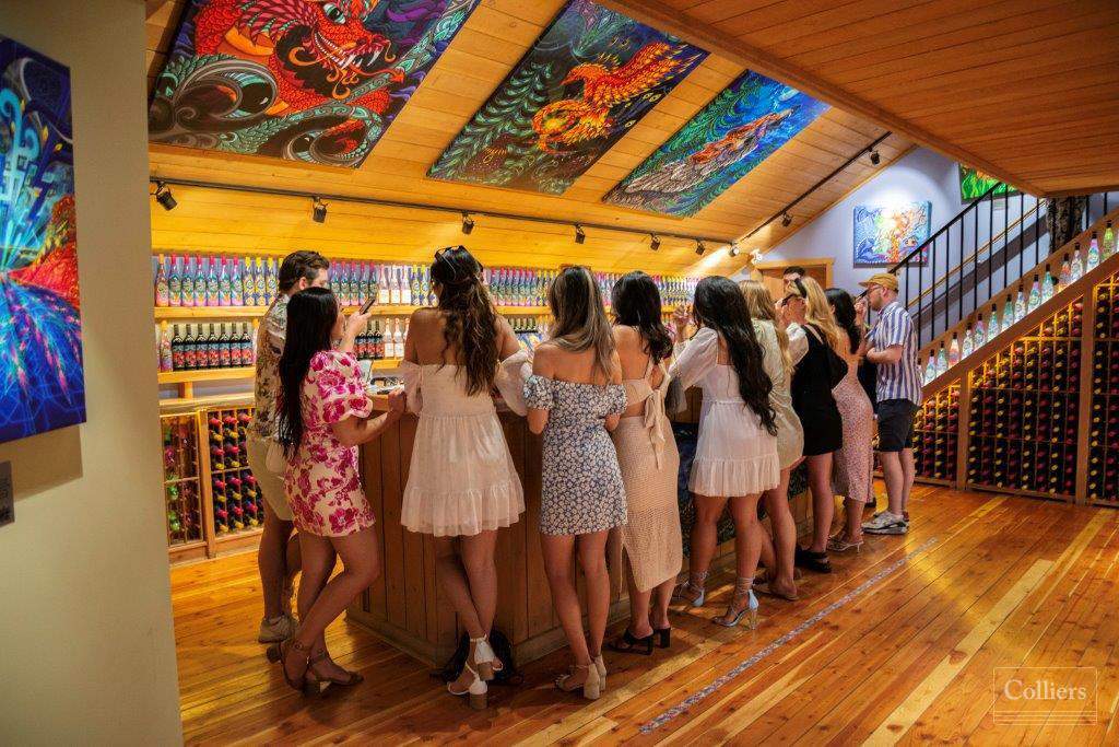 A group tasting wine at Vibrant Vines Winery.
