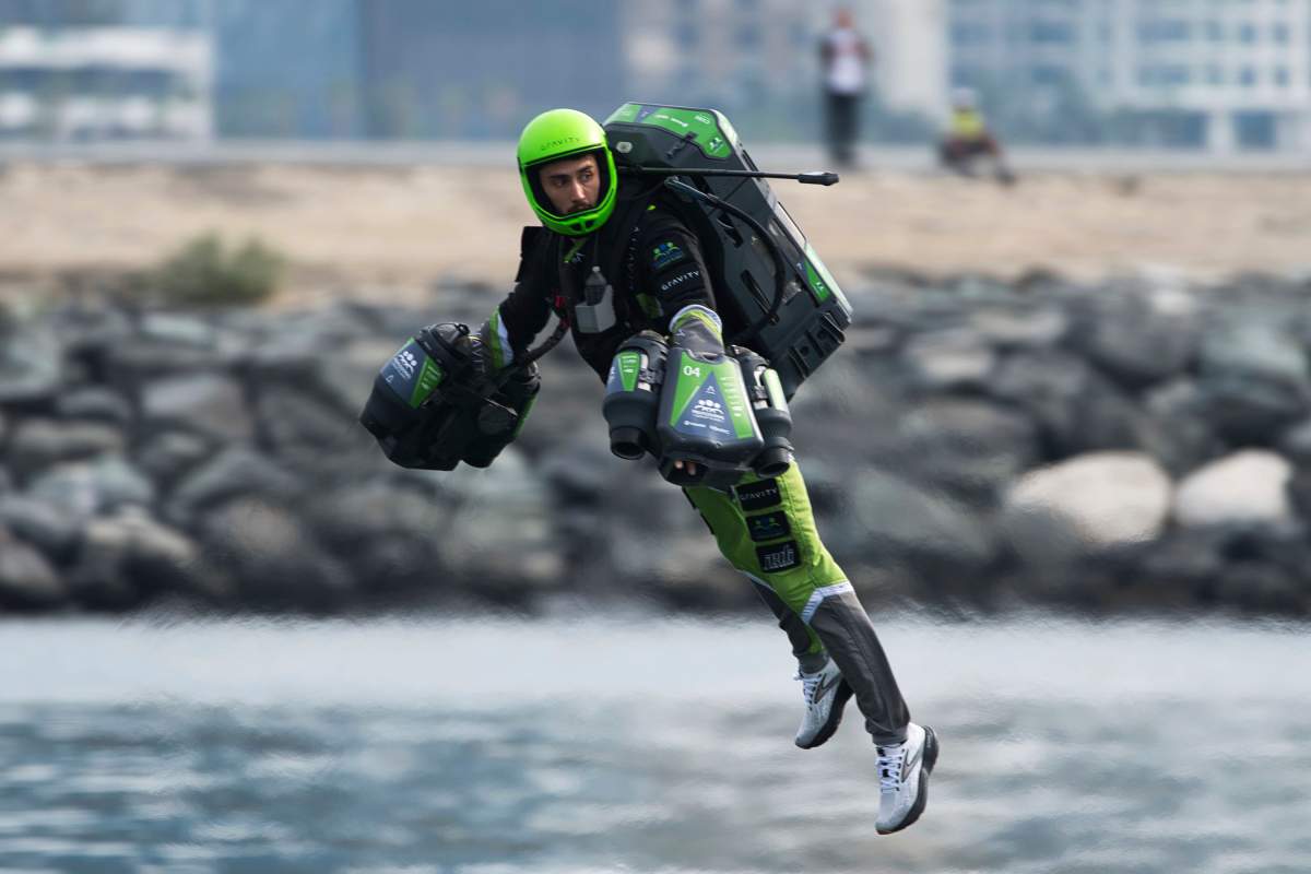 A jet suit pilot races in Dubai, United Arab Emirates, Wednesday, Feb. 28, 2024. (AP Photo/Jon Gambrell)
