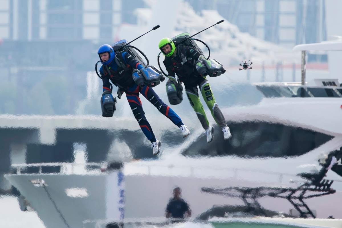 Jet suit pilots race in Dubai, United Arab Emirates, Wednesday, Feb. 28, 2024. (AP Photo/Jon Gambrell)