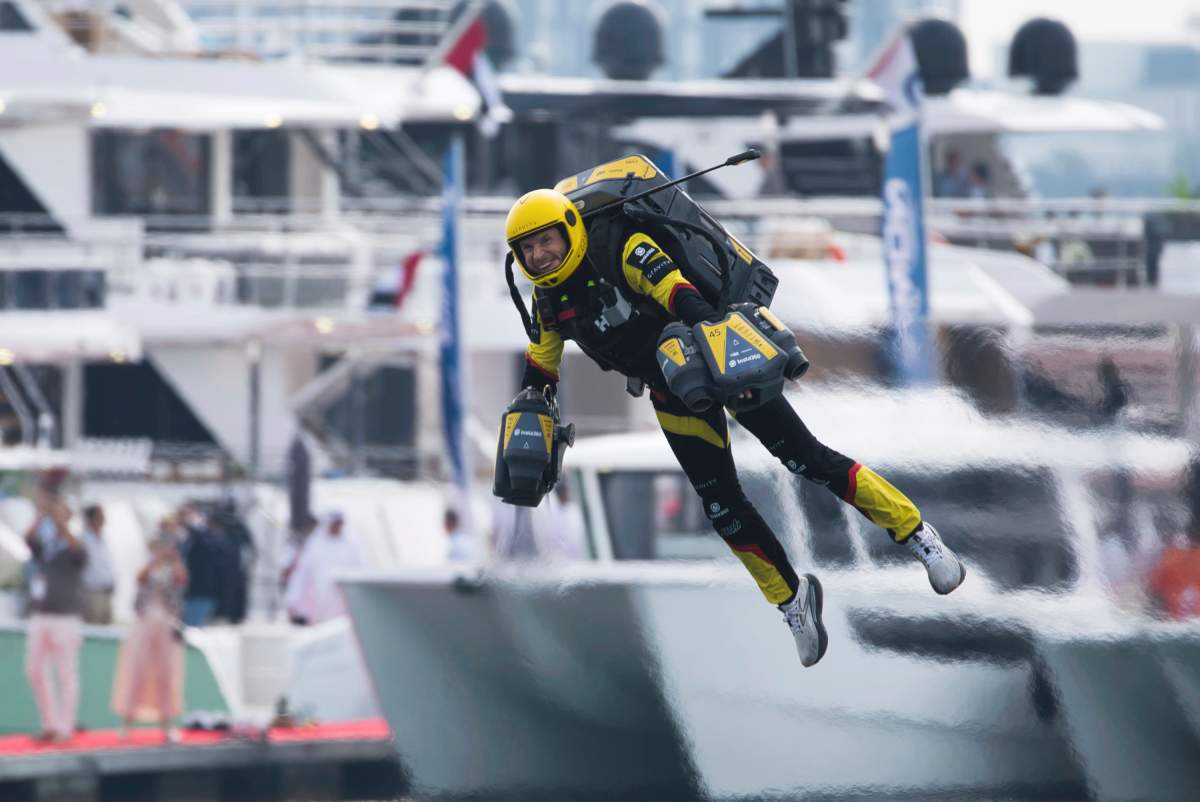 Richard Browning of Gravity Industries races one of his firm’s jet suits in Dubai, United Arab Emirates, Wednesday, Feb. 28, 2024. (AP Photo/Jon Gambrell)