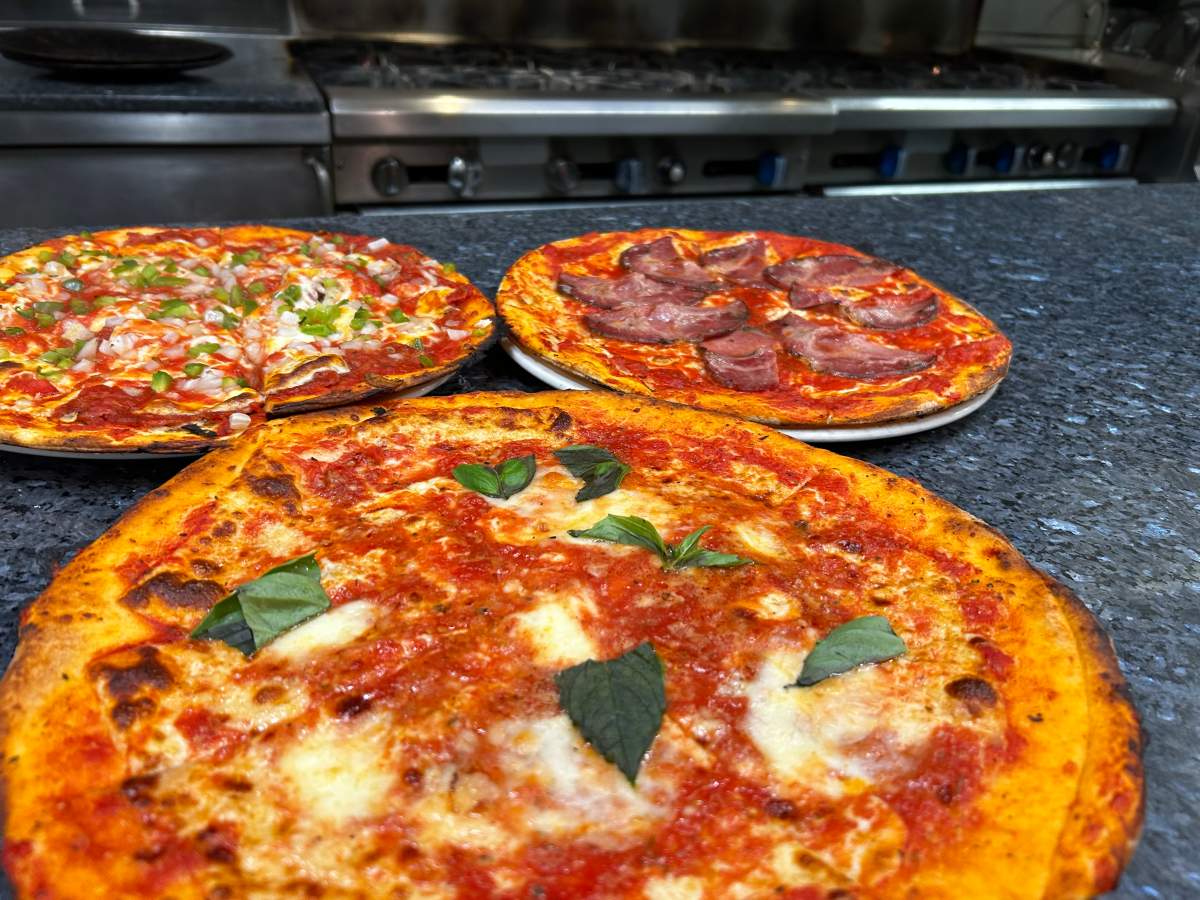 Some classic pizzas from Pizzeria Napoletana in Montreal.
