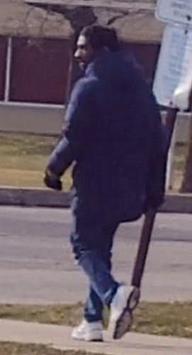 Police are on the lookout for a man who is described as being 20 to 30 years old, 5'7" tall, with short black hair and a short beard.