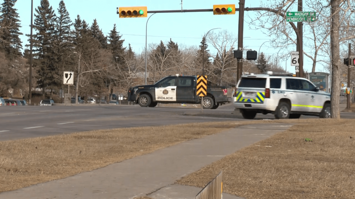 Emergency responders are seen at the corner of Memorial Drive and Penbrooke Drive Southeast on March 14, 2023. Police advised local residents shelter in place and others avoid the area during a shooting incident.