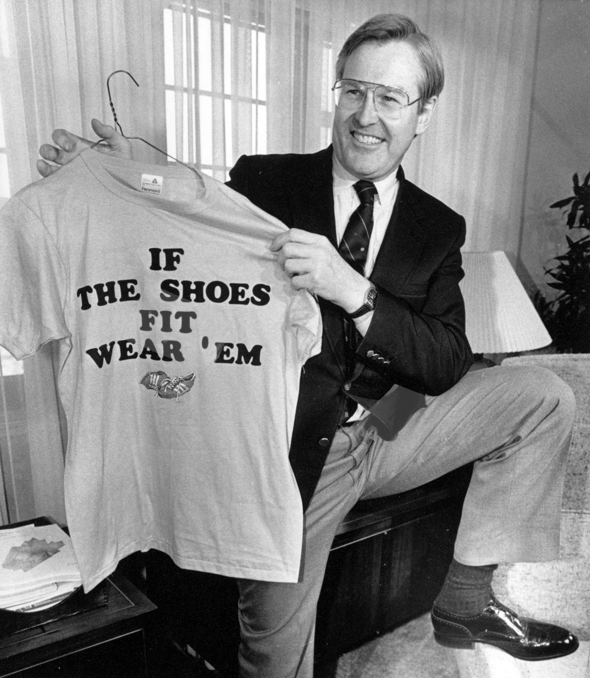 Finance Minister Michael Wilson shows off his new shoes and t-shirt during a photo session in his Parliament Hill office May 22, 1985 before his budget announcement.