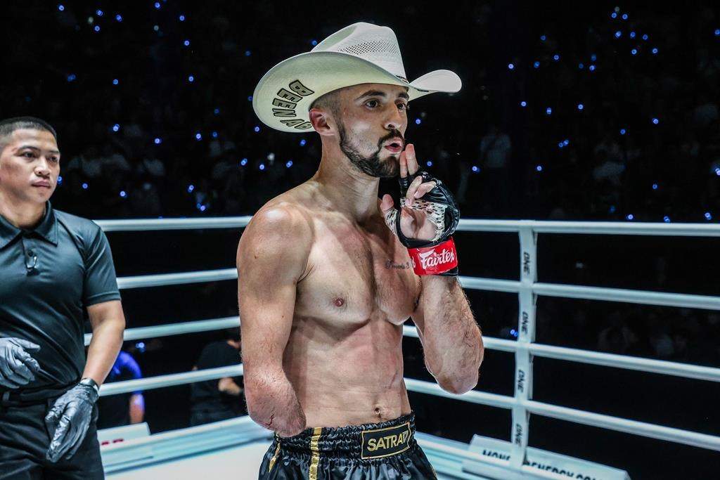 BANGKOK – Calgary’s Jake Peacock celebrates his One Championship debut win over Japanese bantamweight Kohei (Samurai Warrior) Shinjo, not shown, in a Muay Thai bout in Bangkok in a Friday, April 5, 2024, handout photo. The 30-year-old Peacock, who was born without a right hand, improved to 13-1.