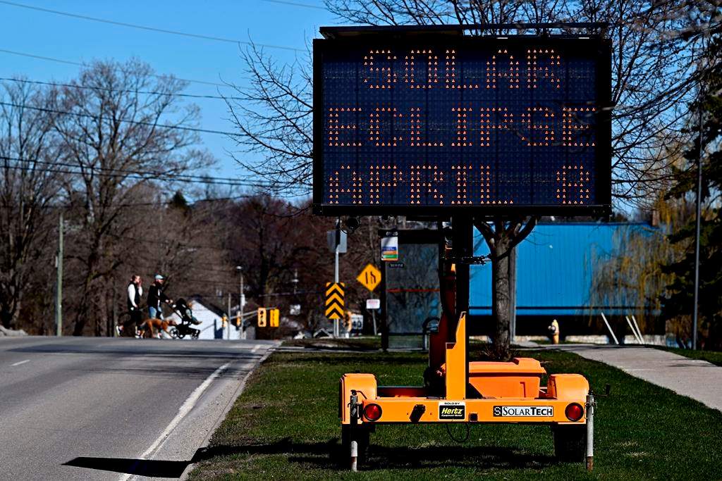 The rotating message on a digital signboard advises people to expect traffic delays, a day before a total solar eclipse will be visible in Kingston.