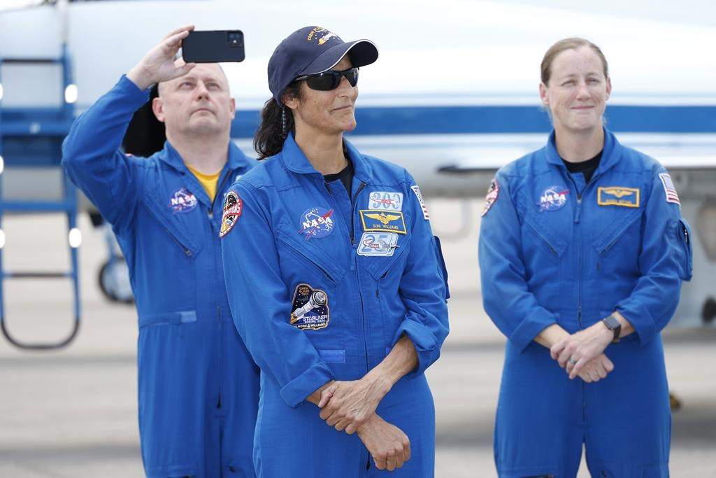 NASA astronaut Suni Williams with support crew in the background speaks to the media after arriving at the Kennedy Space Center, Thursday, April 25, 2024, in Cape Canaveral, Fla. The two test pilot crew will launch aboard Boeing’s Starliner capsule atop an Atlas rocket to the International Space Station, scheduled for liftoff on May 6, 2024.