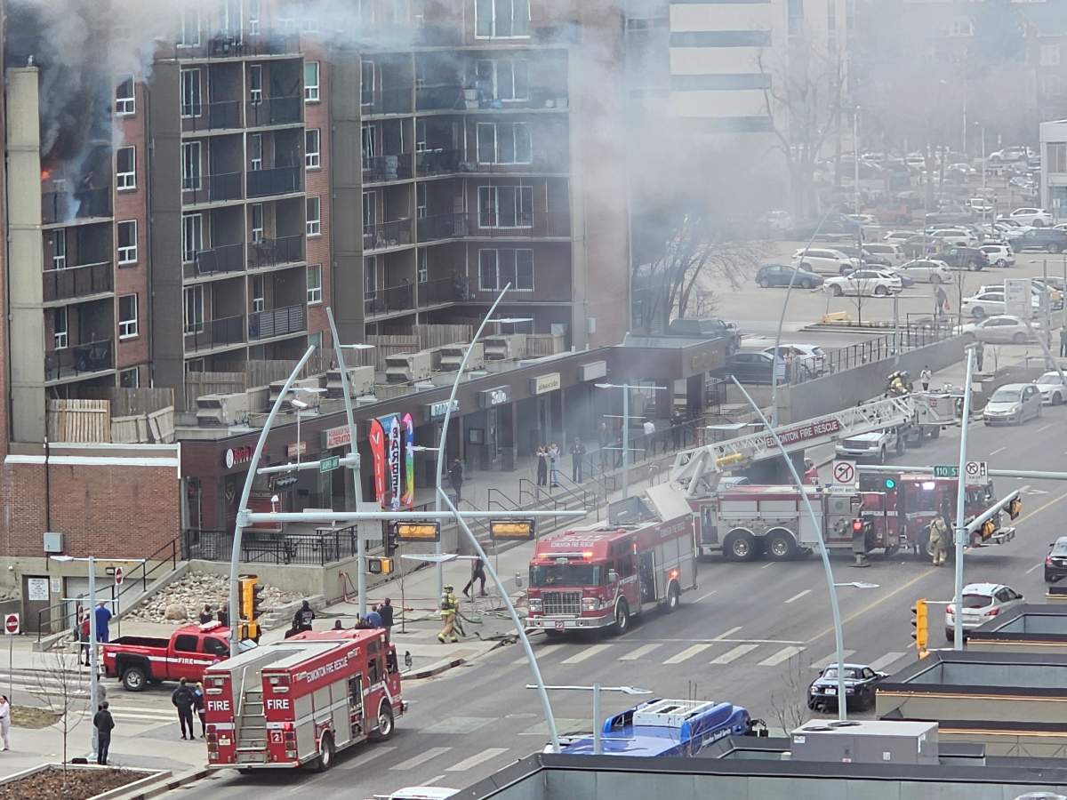 A person was rescued from a fiery balcony as fire crews battled a blaze at an apartment building in the area of Jasper Avenue and 110th Street in Edmonton Thursday, April 25, 2024.