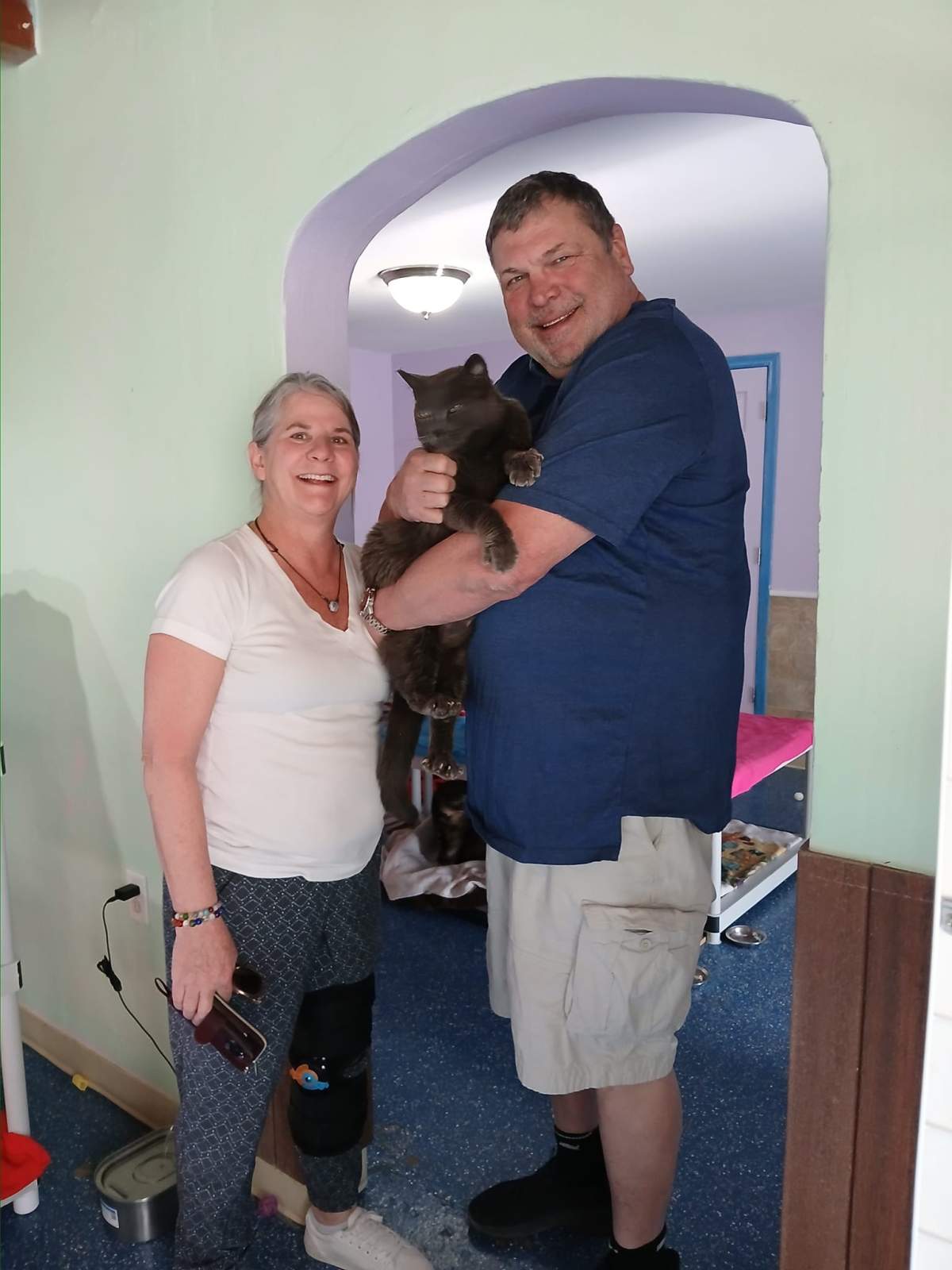 Cindy and Jeff Hall with their Russian Blue cat who went missing five years ago.