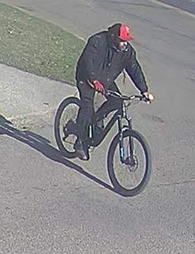 The Edmonton Police Service is searching for this person of interest as they investigate a fire that destroyed Hangar 11 on April 22, 2024.