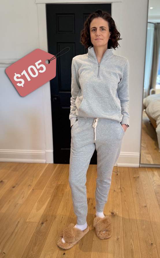 Wearing amazon essentials sweatshirt, joggers in light grey with amazon essentials white socks and fuzzy slippers