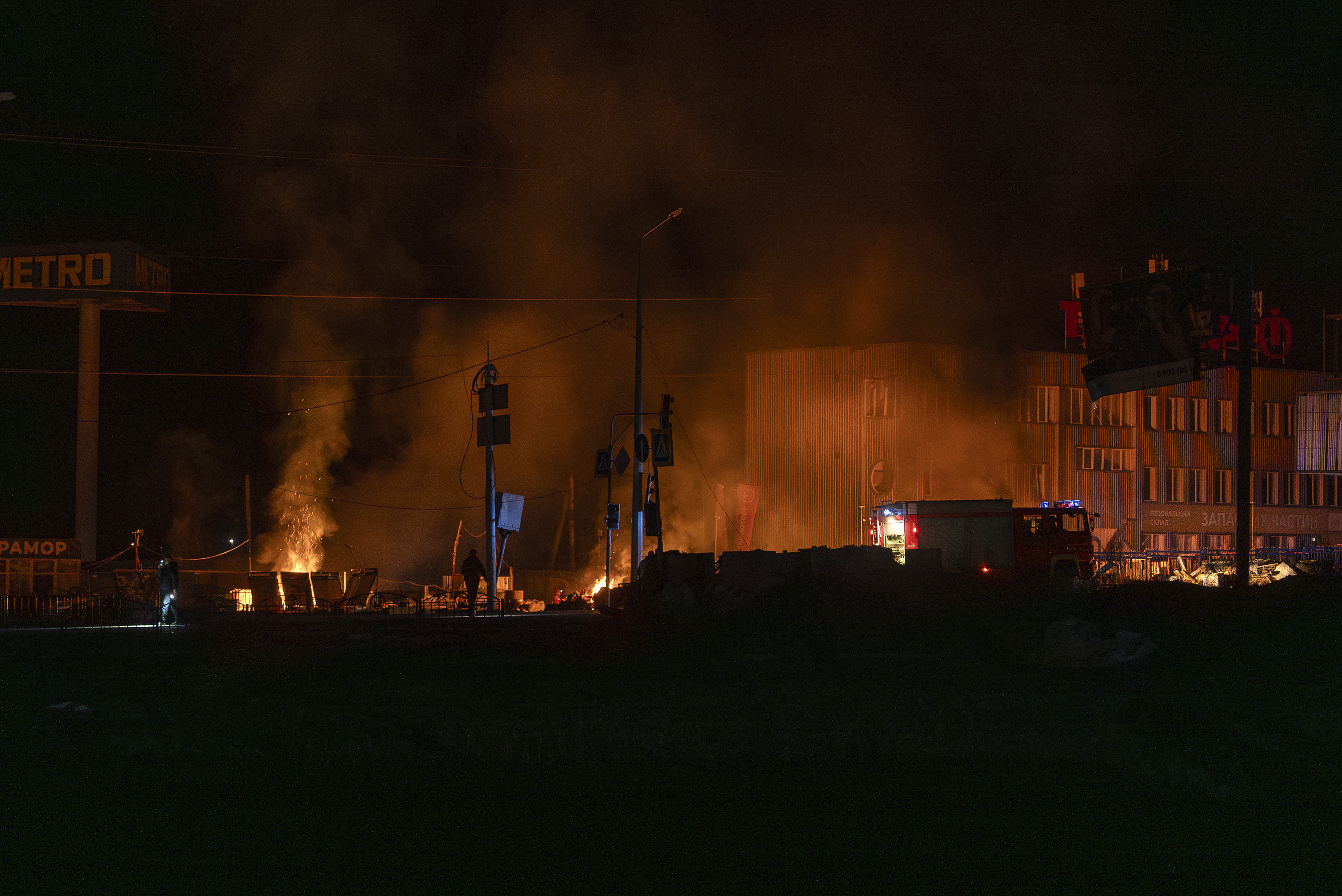 Rescue workers extinguish a fire at the site of a Russian drone attack in Kharkiv, Ukraine on April 6. (AP Photo/Alex Babenko)