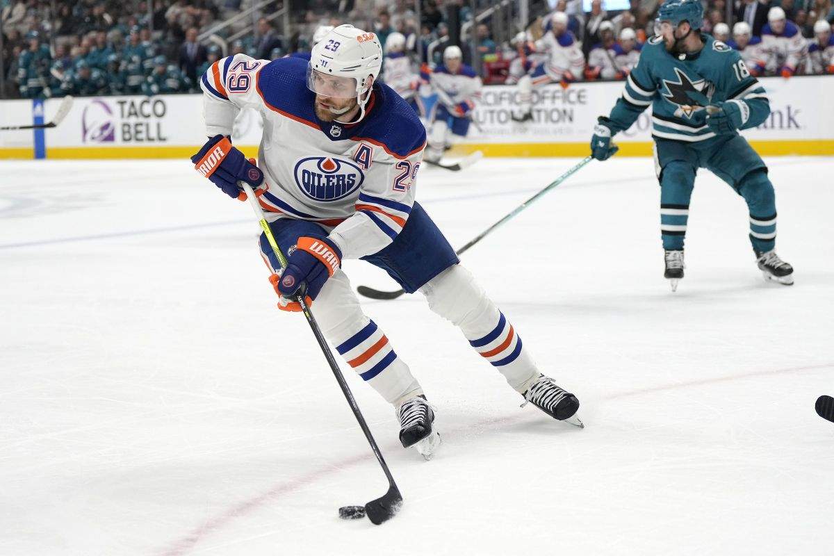 Edmonton Oilers centre Leon Draisaitl (29) moves the puck near San Jose Sharks right wing Filip Zadina (18) during the second period of an NHL hockey game Thursday, Dec. 28, 2023, in San Jose, Calif.
