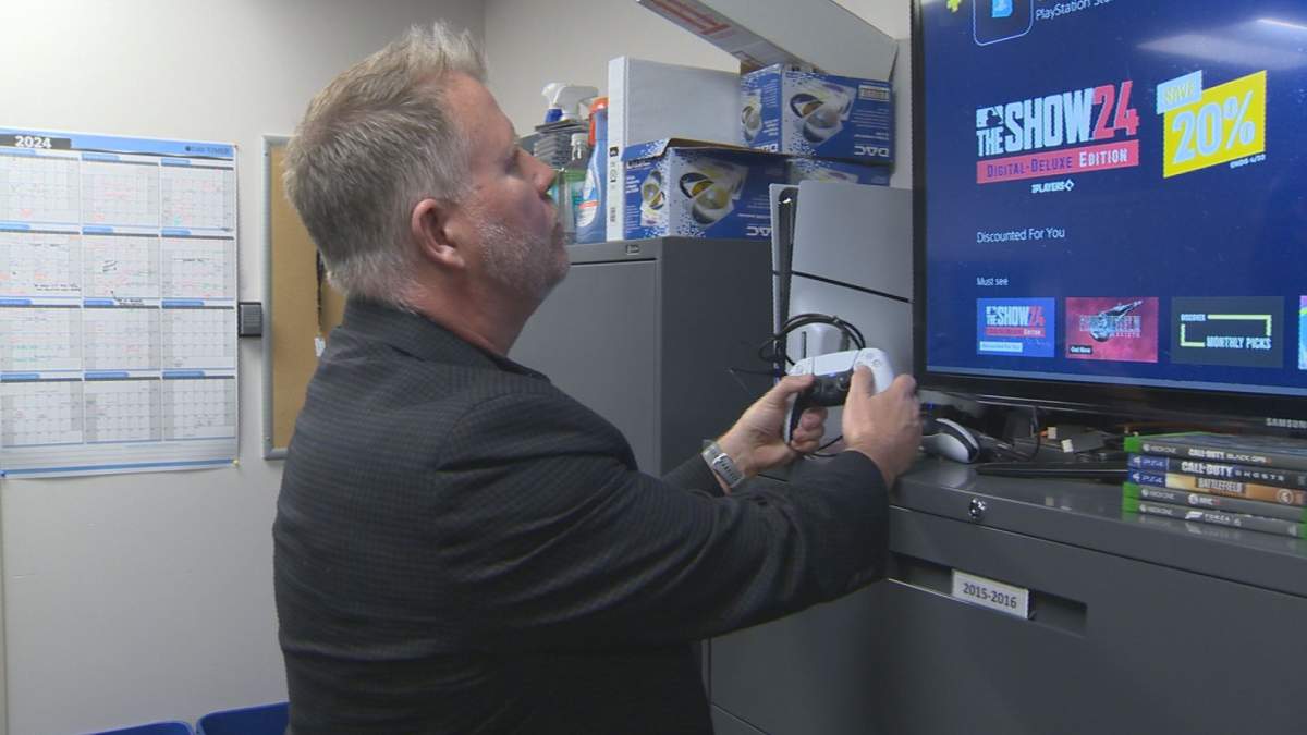 Cst. Grant Kummen with the PlayStation set up inside the ICE unit. The PlayStation helps officers in investigation work, as many predators target and start communicating with children in gaming chatrooms.