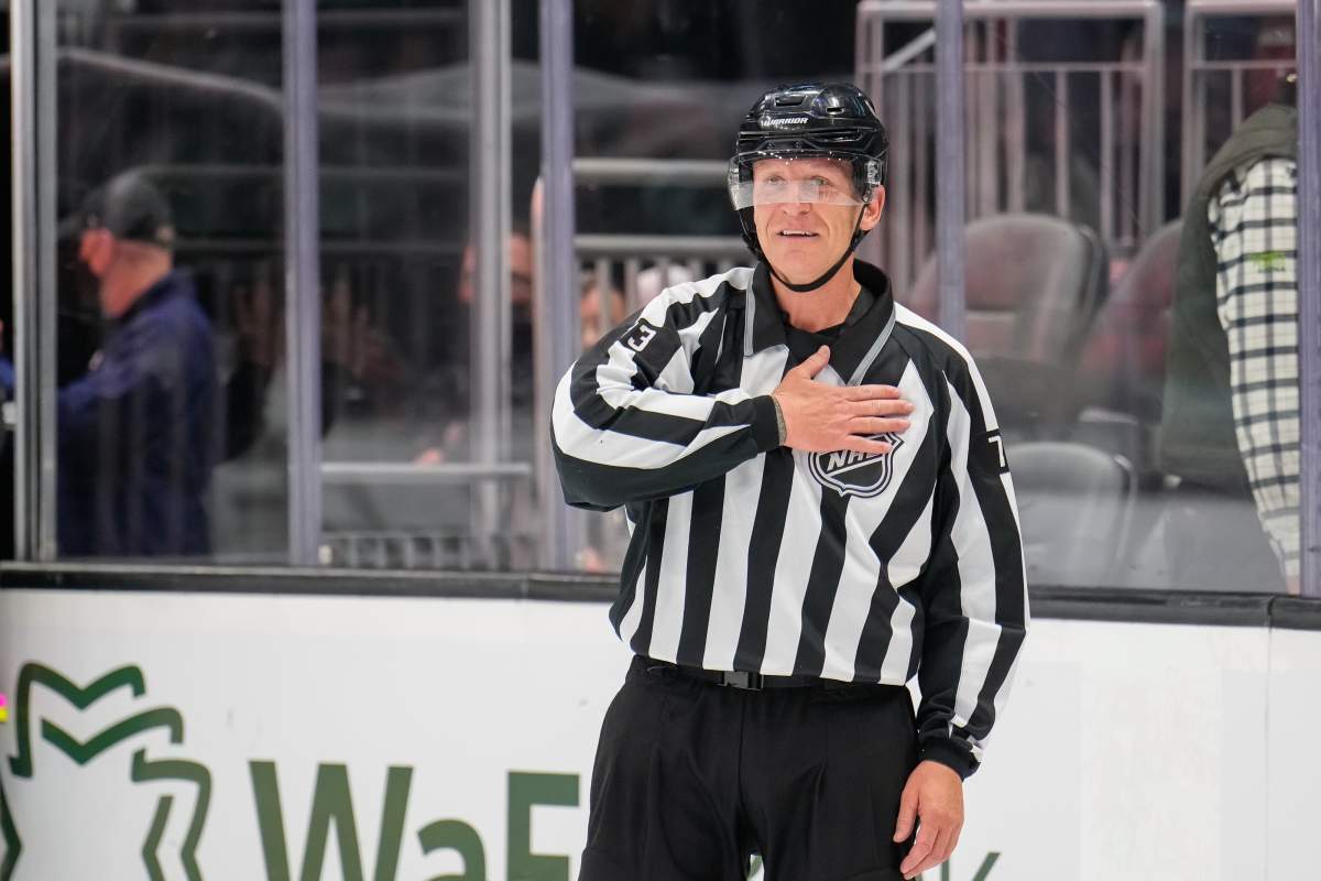 Linesman Vaughan Rody reacts after officiating his final game of a 22 year career during a game between the Seattle Kraken and Colorado Avalanche at Climate Pledge Arena on April 20, 2022 in Seattle, Washington.
