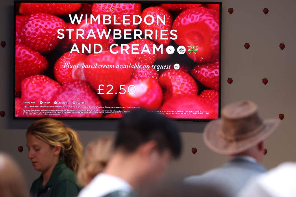 A sign advertises strawberries and cream during day seven of The Championships Wimbledon 2023 at All England Lawn Tennis and Croquet Club on July 09, 2023 in London, England.