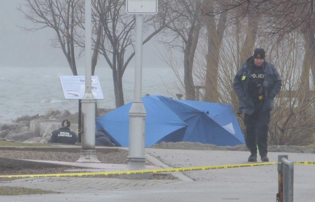 Police on location at Pier 4 in Hamilton, Ont. recovering a body from the shoreline on Apr. 2, 2024.