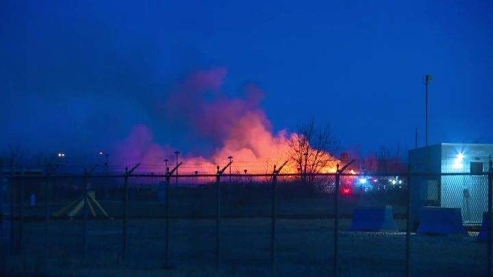 A large grassfire saw Edmonton Fire Rescue Services deploy nine units to an industrial area in a northeast section of the city on Monday morning.