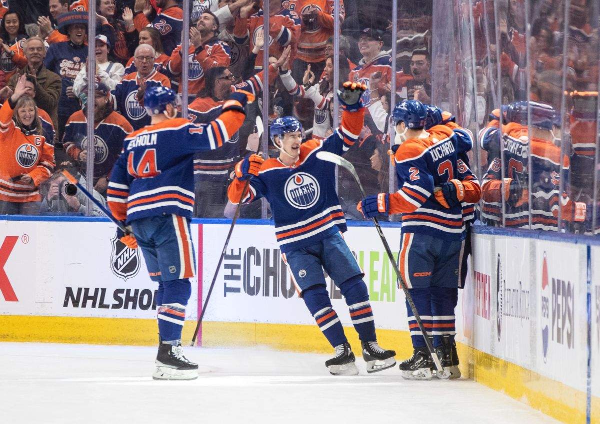 Edmonton Oilers' Mattias Ekholm (14), Ryan McLeod (71), Dylan Holloway (55) and Evan Bouchard (2) celebrate a goal against the Vegas Golden Knights during third period NHL action in Edmonton on Wednesday April 10, 2024.