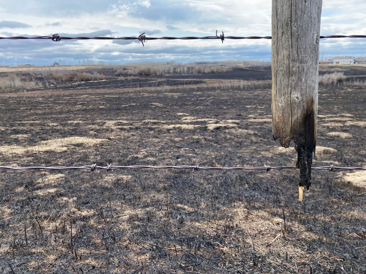 Part of a barb wire fence post was burnt in a fire near Regina Beach on April 21, 2024.