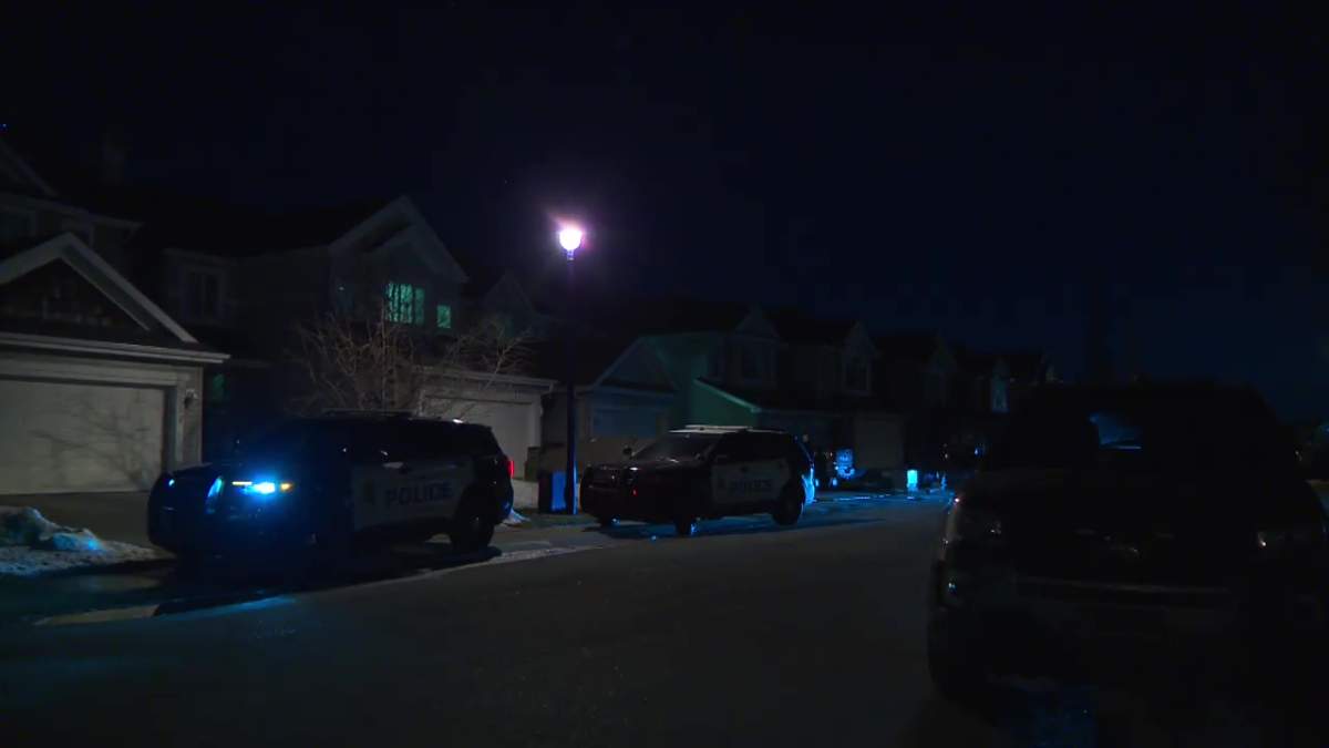 Edmonton police at a home near 82 Street and 11 Avenue SW in Summerside, where a child was fatally attacked by dogs on Monday, April 1, 2024.